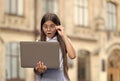 stylish surprised pupil girl studying homework during her online lesson while social distance during quarantine, online