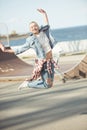 Stylish teenage girl jumping at skateboard park Royalty Free Stock Photo