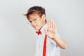 A stylish teenager boy wearing glasses showing stop gesture with his palm Royalty Free Stock Photo