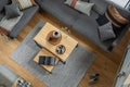 Stylish top view composition of living room interior with corner grey sofa, coffee table. Royalty Free Stock Photo