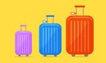 Stylish travel suitcases on yellow background