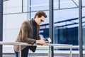 stylish traveller in jacket with passport and tickets in urban c Royalty Free Stock Photo