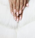 Stylish trendy female pink French manicure on white