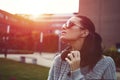 Stylish trendy urban woman enjoying sunset in sunglasses Royalty Free Stock Photo