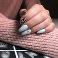Stylish trendy white female manicure.Hands of a woman with white manicure on nails