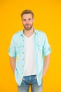 Stylish unshaven guy wear casual shirt on yellow background, male fashion