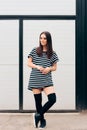 Cool Fashion Girl Wearing Long Black Socks and Shirt Dress Royalty Free Stock Photo