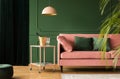 Velvet sofa in pink and green living room