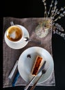 Stylish vertical instagram flat lay made in the cafe. Coffee cappuccino and cheesecake on the plate. Lavender and rustic cloth on