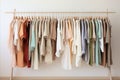 Stylish and vibrant fashion clothes displayed on colorful clothing rack in a fashionable closet