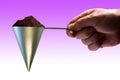 Stylish view of hand holding conical coffee scoop