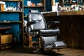 Stylish vintage barber chair. Barbershop theme. Professional hairstylist in barbershop interior. Barber shop chair Royalty Free Stock Photo