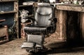 Stylish vintage barber chair. Professional hairstylist in barbershop interior. Barbershop interior. Barber shop chair Royalty Free Stock Photo