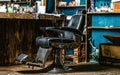 Stylish vintage barber chair. Professional hairstylist in barbershop interior. Barber shop chair. Barbershop armchair Royalty Free Stock Photo