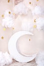 Stylish vintage children`s room with a wooden moon and textile clouds. Children location for a photo shoot. Moon with stars and cl
