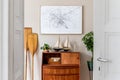 Vintage, wooden commode, plants and stylish interior accessories.