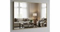 Stylish Living Room Reflected in a Large Gold-Framed Wall Mirror Royalty Free Stock Photo