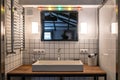 Stylish washbasin in modern bathroom interior with mirror and bright lights