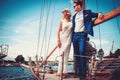 Stylish wealthy couple on a luxury yacht Royalty Free Stock Photo