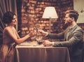 Stylish wealthy couple toasting with champagne Royalty Free Stock Photo