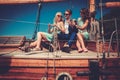 Stylish wealthy friends having fun on a luxury yacht Royalty Free Stock Photo