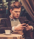 Stylish wealthy man using mobile phone Royalty Free Stock Photo