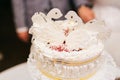 Stylish wedding cake decorated with white chocolate swans Royalty Free Stock Photo