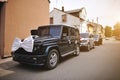 Stylish wedding cortege of cars with a bow and hat Royalty Free Stock Photo