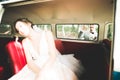 Stylish wedding couple, bride, groom kissing and hugging on retro car Royalty Free Stock Photo