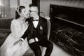 Stylish wedding couple in the interior. Glamorous bride and groom, black and white photo