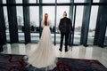 Stylish wedding couple in the interior. Glamorous bride and groom