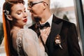 Stylish wedding couple in the interior. Glamorous bride and groom