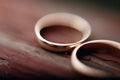 stylish wedding rings macro view on wooden aged background. wedding preparation in morning, luxury pair jewelry