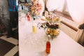 Stylish wedding table with delicious cakes and alcohol Royalty Free Stock Photo