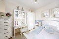 Stylish white bedroom with big bed, wardrobe Royalty Free Stock Photo