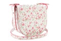 Stylish white female bag with small pink flowers, with a strap on a white background Royalty Free Stock Photo