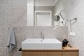 Stylish washbasin in bathroom with modern, patterned tiles