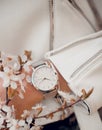 Beautiful white watch on woman hand