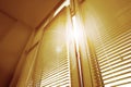 Stylish window with horizontal blinds in room, low angle view Royalty Free Stock Photo