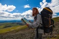 Stylish woman with backpack hiking Royalty Free Stock Photo