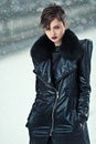 Stylish woman in leather coat