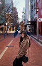 Stylish woman raising hands up for positive feeling and celebrat Royalty Free Stock Photo