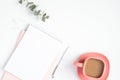 Stylish woman`s workspace with paper notebook and pink coffee cup. Modern minimal style feminine home office desk concept Royalty Free Stock Photo