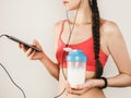 Stylish woman studying the results of her workout Royalty Free Stock Photo