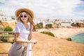 Stylish woman at the summer beach in a hot day in summer hat and sunglasses Royalty Free Stock Photo