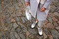 Stylish woman with trendy white baguette bag on city street, closeup Royalty Free Stock Photo