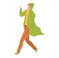 Stylish woman walking confidently wearing green coat brown pants. Casual urban female fashion city