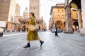 Stylish woman walks the street in Bologna city Royalty Free Stock Photo