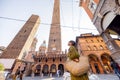 Stylish woman walks the street in Bologna city Royalty Free Stock Photo