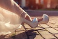 Stylish woman wearing high heeled shoes and white dress outdoors. Beauty fashion. Royalty Free Stock Photo